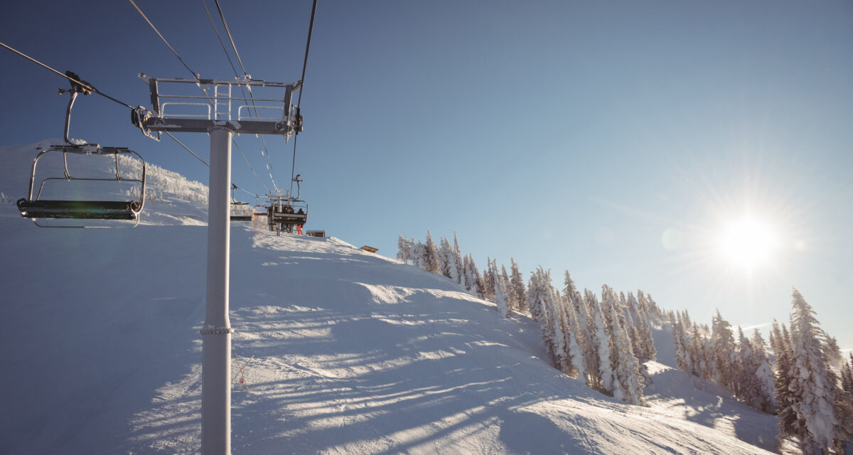 Empty ski lift in the ski resort against blue sky Empty ski lift in the ski resort against blue sky
